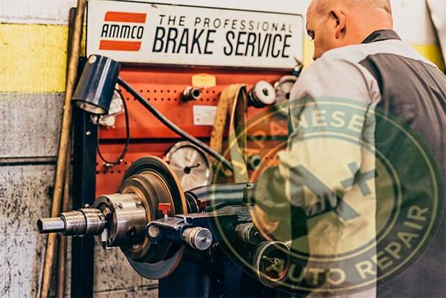 Brake mechanic turning rotors on a brake lathe machine - A+ Japanese Auto Repair Inc.